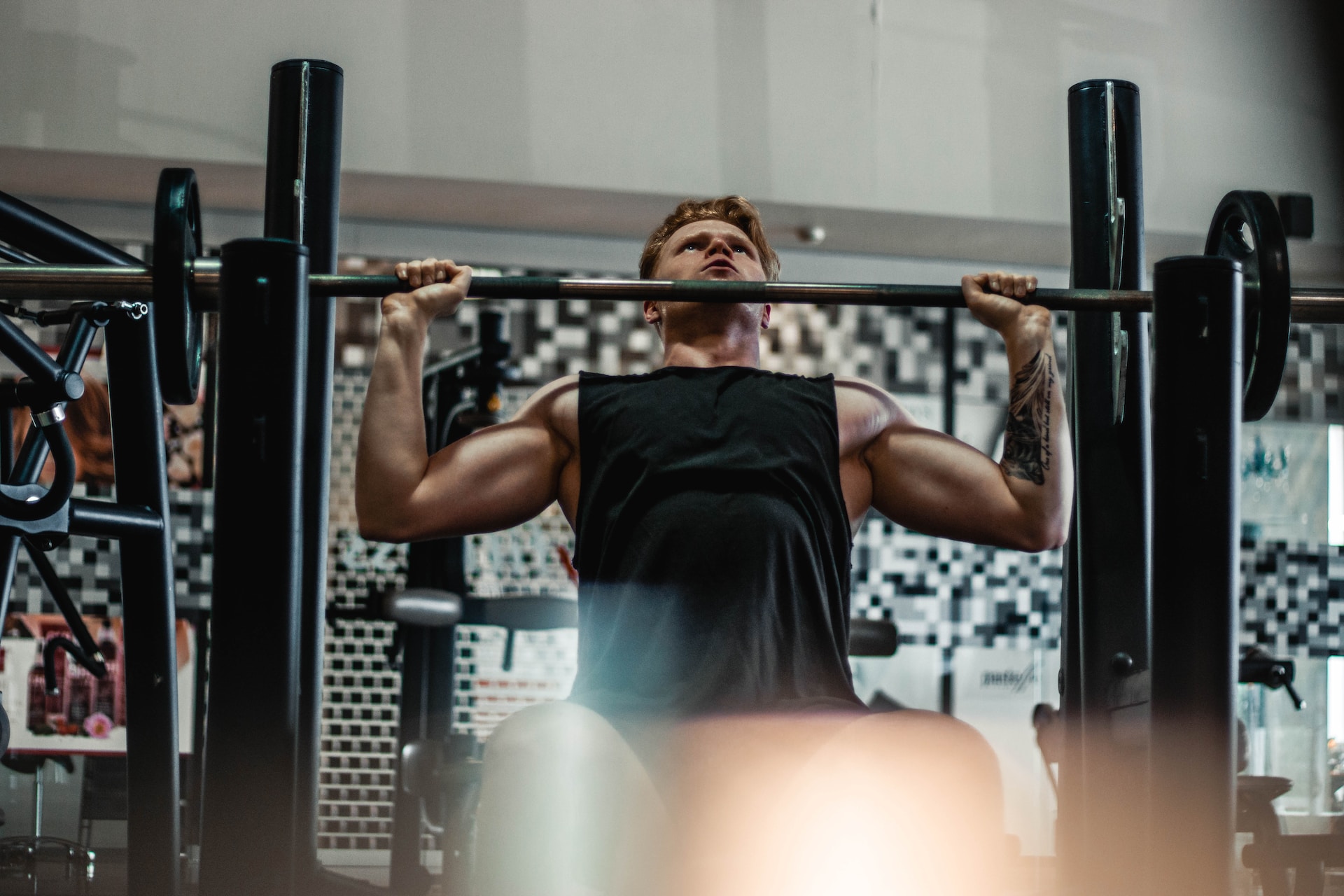 Photo of man lifting a barbell