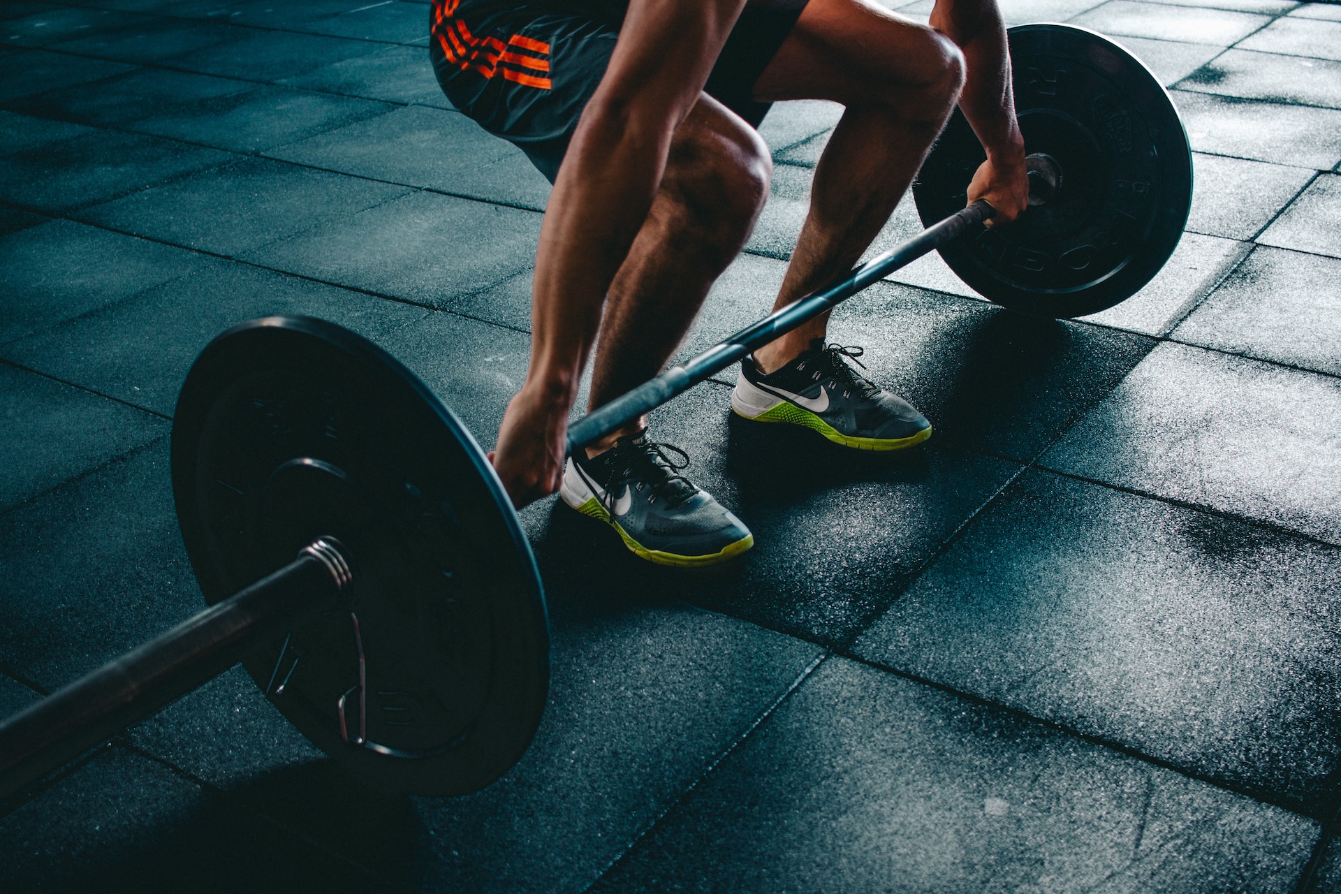 Photo of man deadlifting a barbell